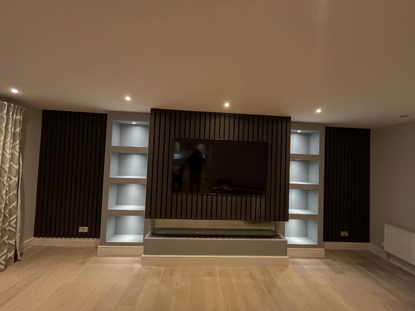 Bespoke media wall with panelling built by JTC Construction