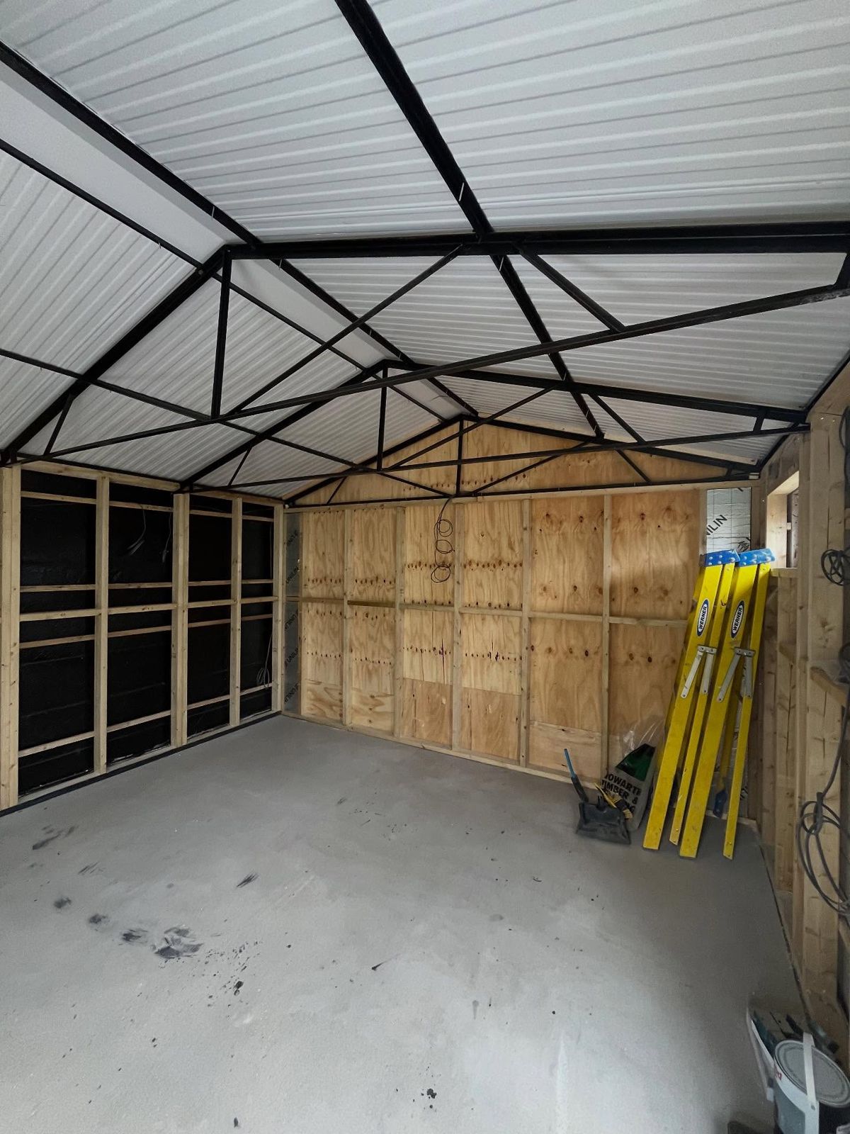 Roof trusses and timber studwork going in