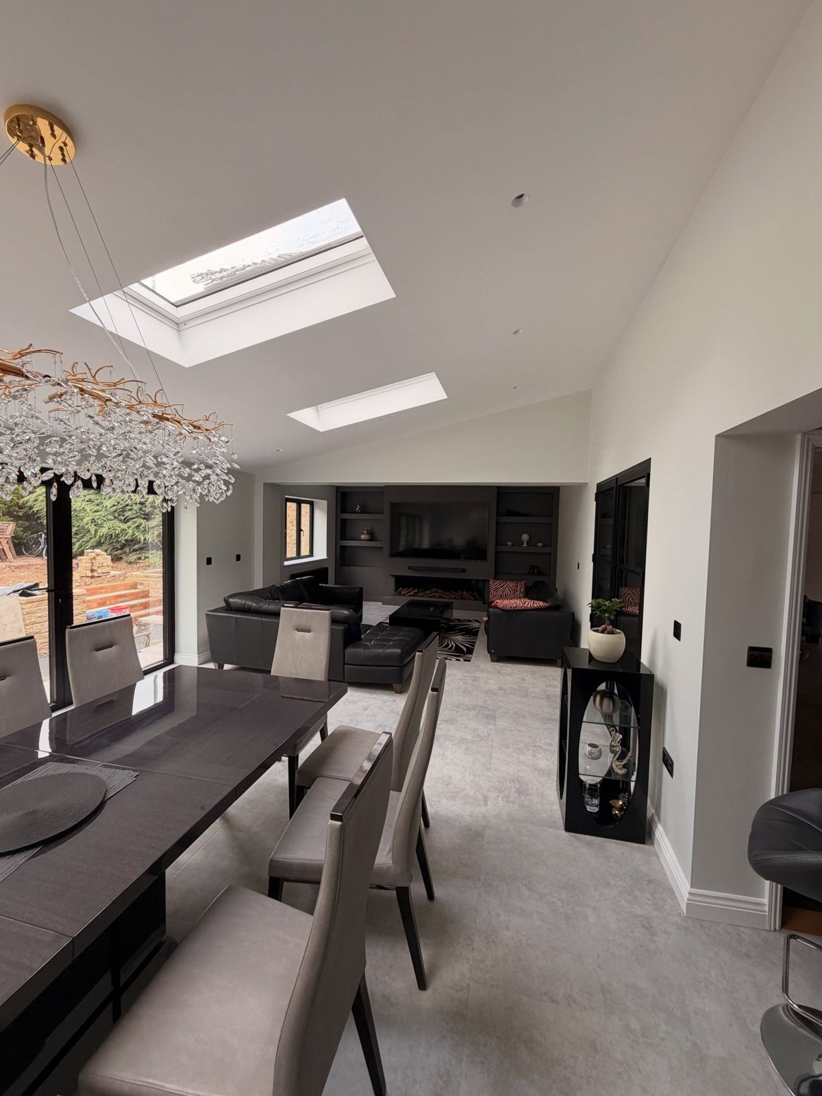 Open-plan dining and living space with rooflights